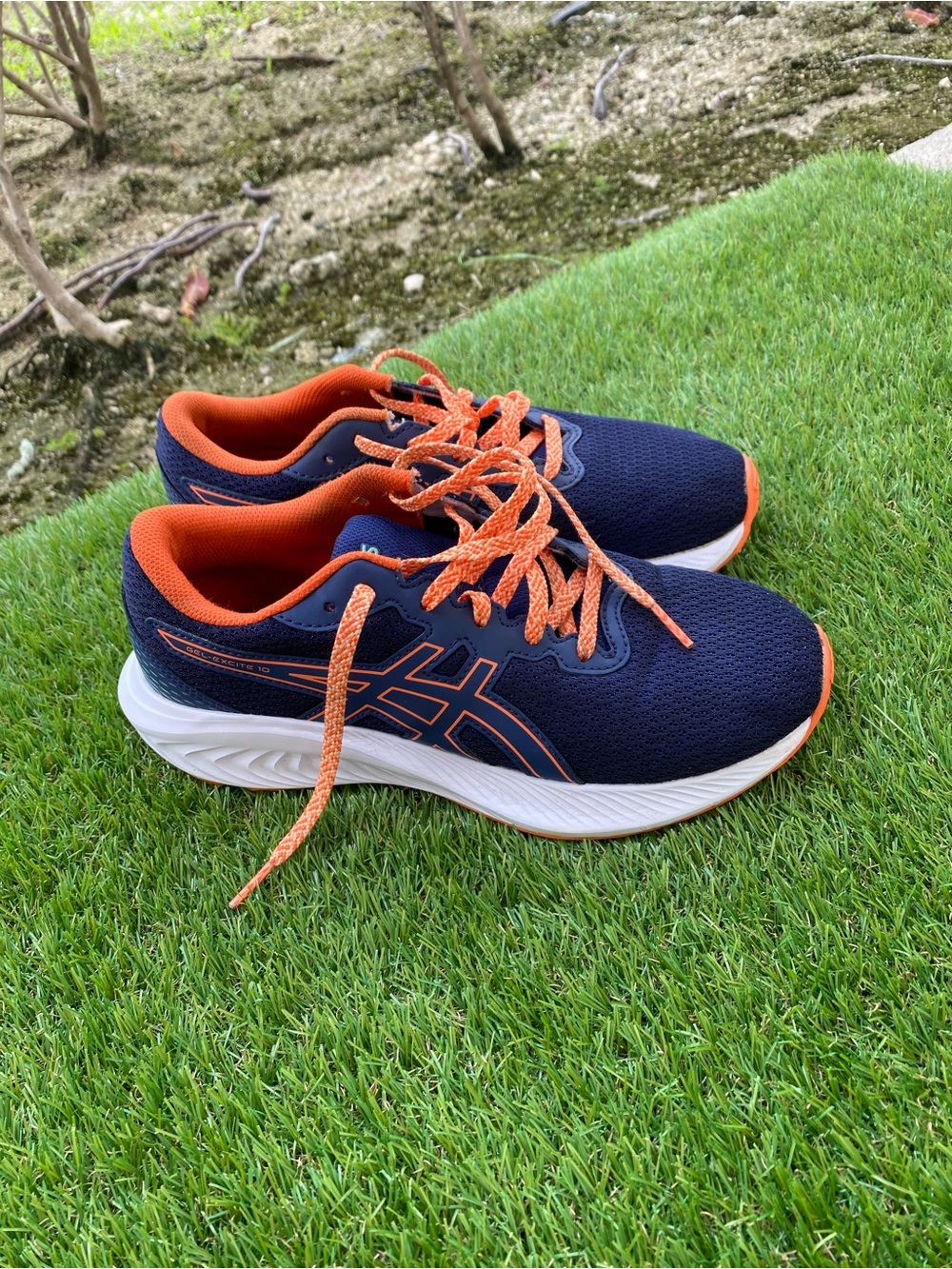 Asics Kids Navy Sneakers with Bright Orange Accents